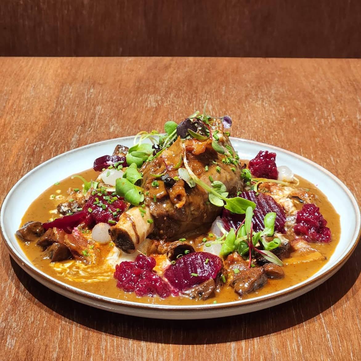 Braised lamb shank on a plate